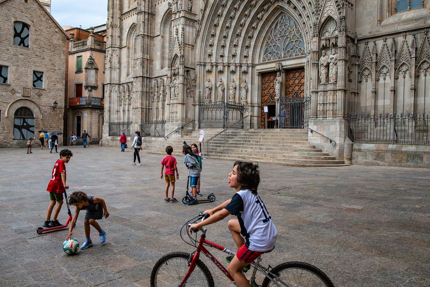 Barcelona-Sergi-Bernal-1440 Kids playing on a square in Barcelona.